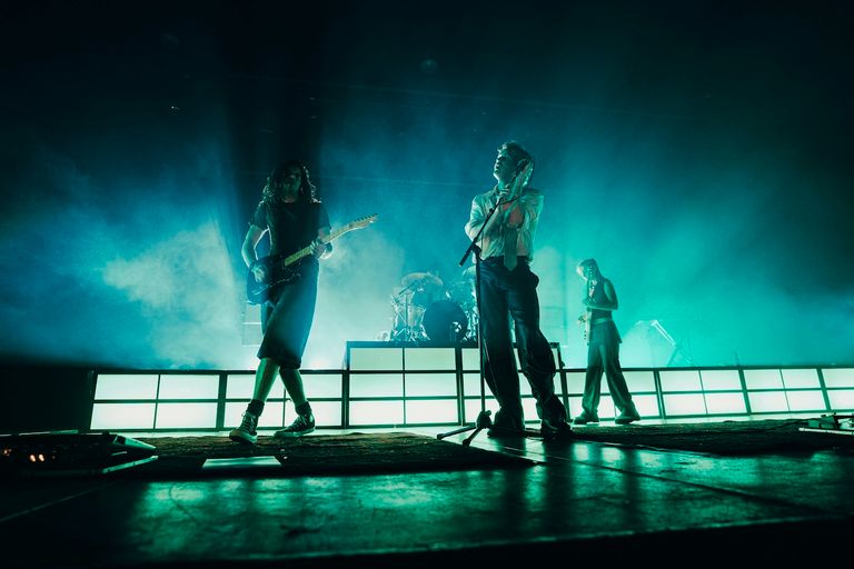 Spacey Jane performing live onstage under teal blue backlighting with smoke, captured in concert photography by Charlie Hardy.